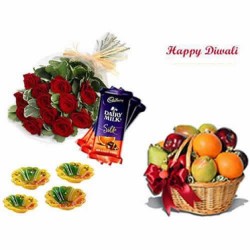 Frutis basket, dairy milk silk, rose bunch and diyas